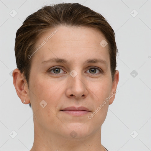 Joyful white young-adult female with short  brown hair and grey eyes