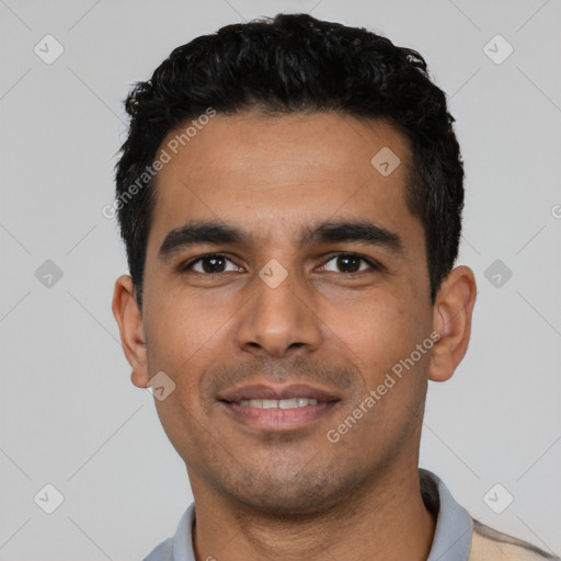 Joyful latino young-adult male with short  black hair and brown eyes