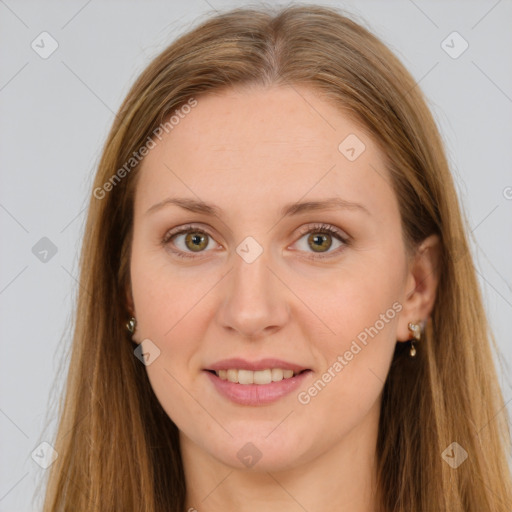 Joyful white young-adult female with long  brown hair and brown eyes