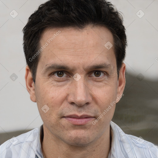 Joyful white adult male with short  brown hair and brown eyes