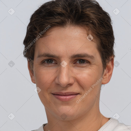 Joyful white adult female with short  brown hair and brown eyes