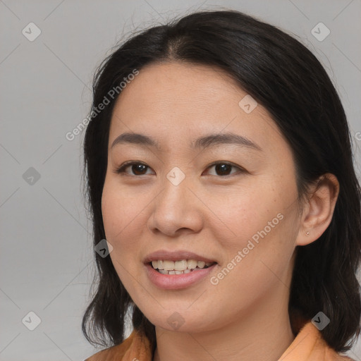 Joyful asian young-adult female with medium  brown hair and brown eyes