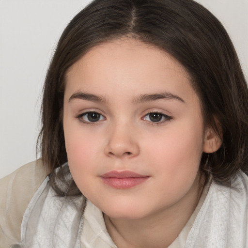 Joyful white child female with medium  brown hair and brown eyes