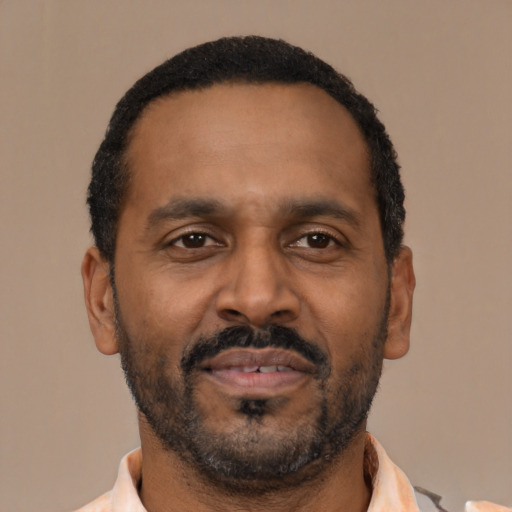 Neutral latino adult male with short  black hair and brown eyes