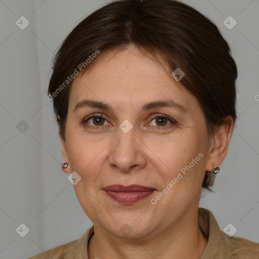 Joyful white adult female with short  brown hair and brown eyes