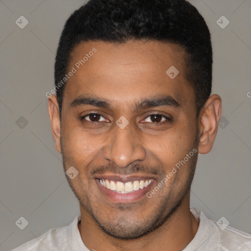 Joyful latino young-adult male with short  brown hair and brown eyes