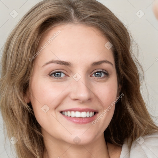 Joyful white young-adult female with medium  brown hair and green eyes