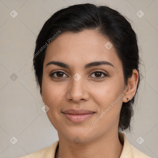 Joyful latino young-adult female with medium  brown hair and brown eyes