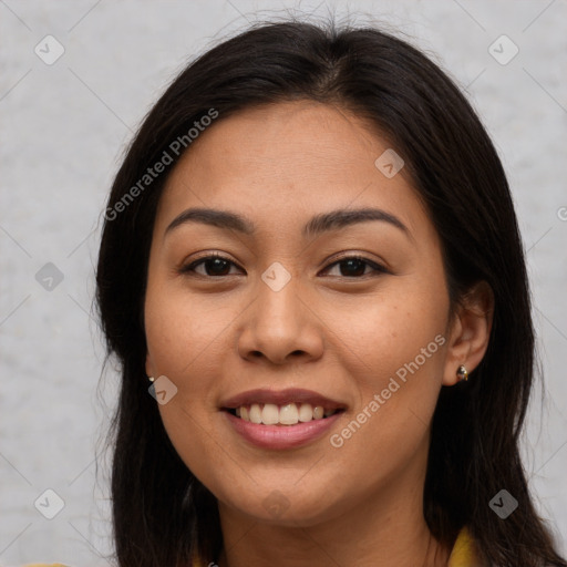 Joyful asian young-adult female with long  brown hair and brown eyes