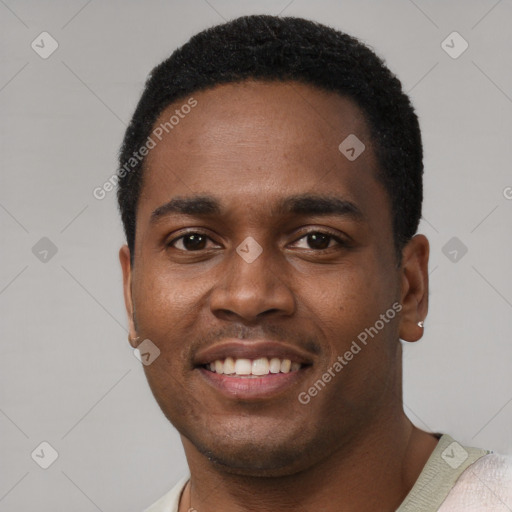 Joyful black young-adult male with short  black hair and brown eyes