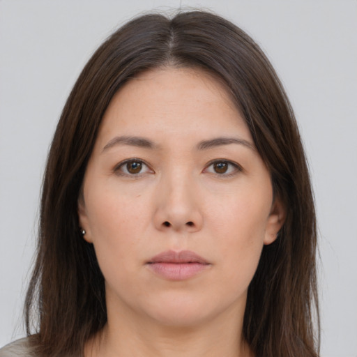 Neutral white young-adult female with long  brown hair and brown eyes