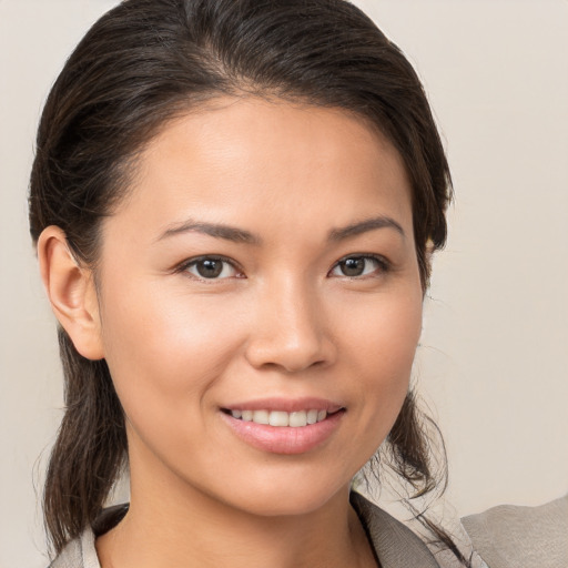 Joyful white young-adult female with medium  brown hair and brown eyes