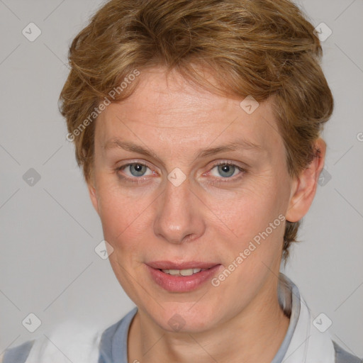 Joyful white adult female with medium  brown hair and blue eyes