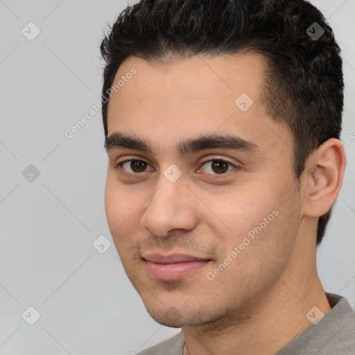 Joyful white young-adult male with short  black hair and brown eyes