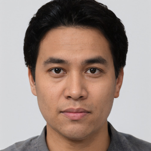 Neutral asian young-adult male with short  black hair and brown eyes