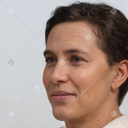 Joyful white adult female with short  brown hair and brown eyes