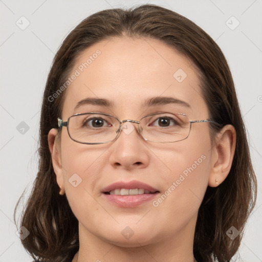 Joyful white adult female with medium  brown hair and grey eyes