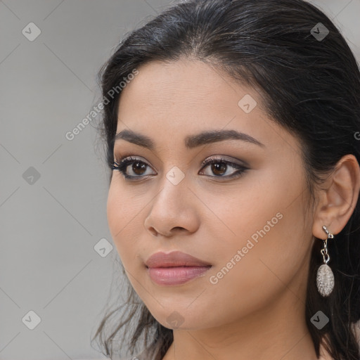 Joyful latino young-adult female with long  brown hair and brown eyes