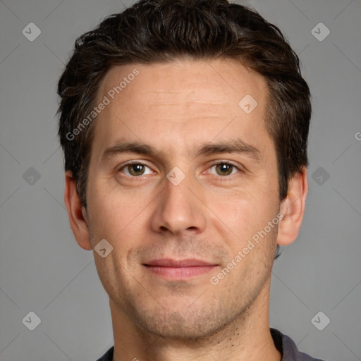 Joyful white adult male with short  brown hair and brown eyes