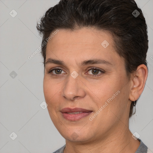 Joyful white adult female with short  brown hair and brown eyes