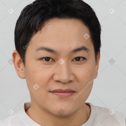 Joyful asian young-adult male with short  brown hair and brown eyes