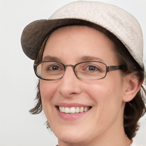 Joyful white adult female with medium  brown hair and blue eyes