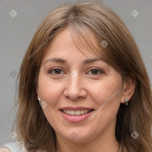 Joyful white adult female with medium  brown hair and brown eyes