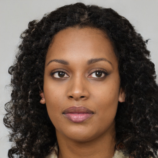 Neutral black young-adult female with medium  black hair and brown eyes
