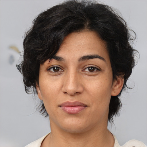Joyful asian adult female with medium  brown hair and brown eyes