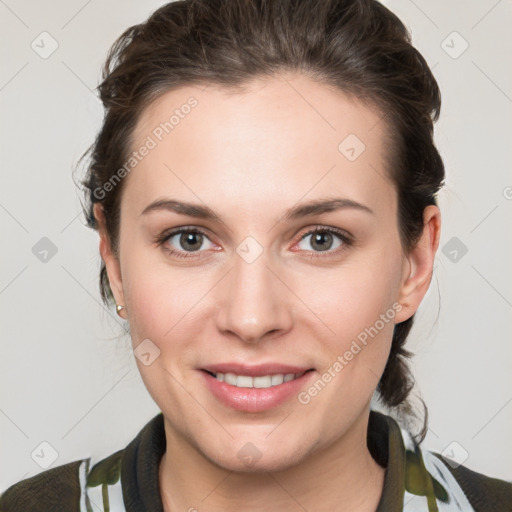 Joyful white young-adult female with medium  brown hair and grey eyes