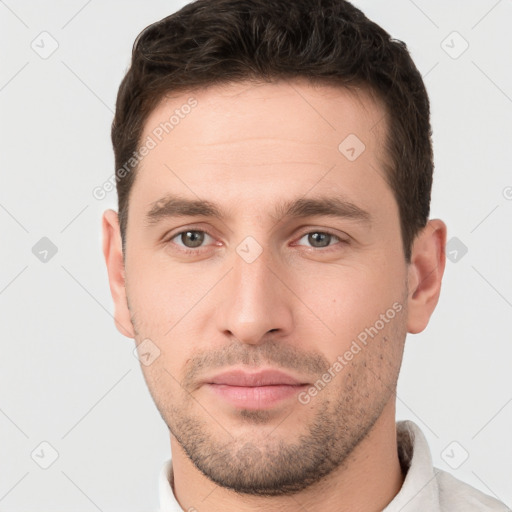 Neutral white young-adult male with short  brown hair and brown eyes