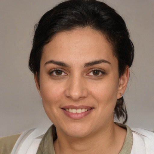 Joyful white young-adult female with medium  brown hair and brown eyes