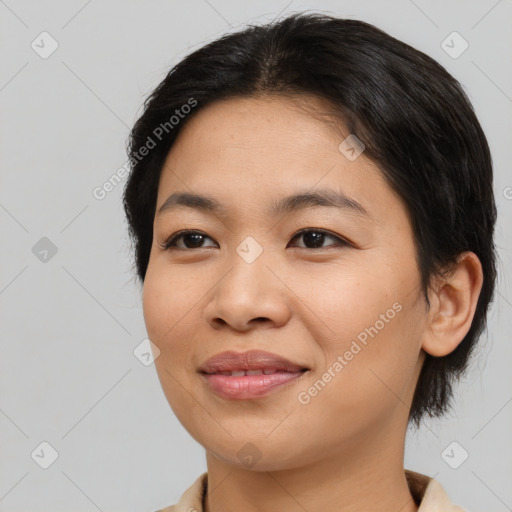 Joyful asian young-adult female with medium  brown hair and brown eyes