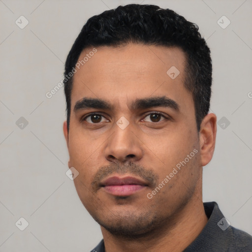 Neutral latino young-adult male with short  black hair and brown eyes