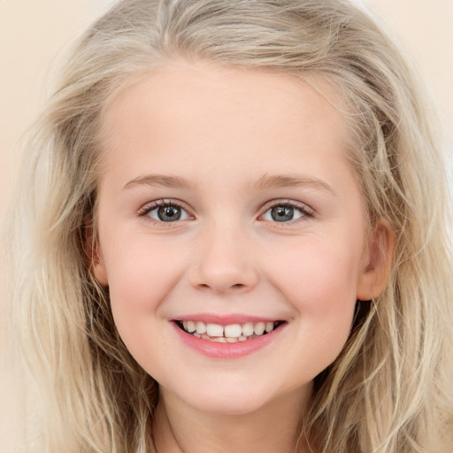 Joyful white child female with long  brown hair and blue eyes