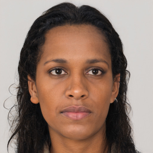 Neutral black young-adult female with long  brown hair and brown eyes