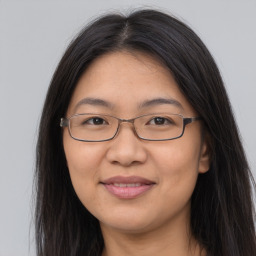 Joyful white adult female with long  brown hair and brown eyes