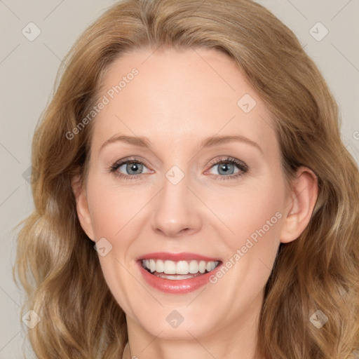 Joyful white young-adult female with long  brown hair and blue eyes