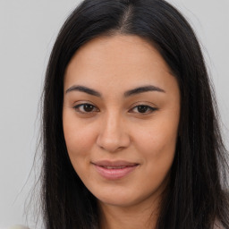 Joyful asian young-adult female with long  brown hair and brown eyes