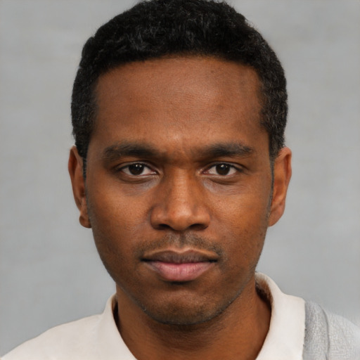 Neutral black young-adult male with short  black hair and brown eyes