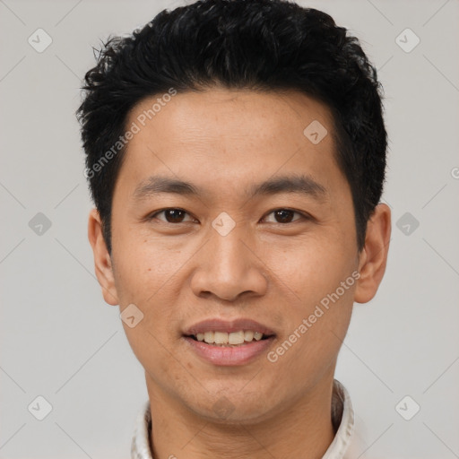 Joyful asian young-adult male with short  black hair and brown eyes