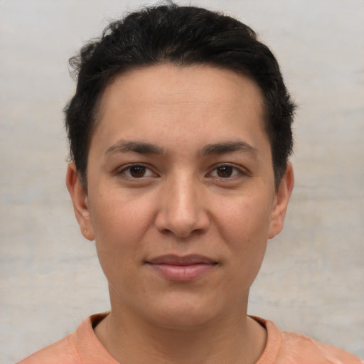 Joyful white young-adult female with short  brown hair and brown eyes