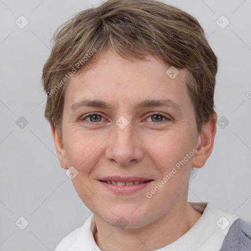 Joyful white young-adult female with short  brown hair and grey eyes