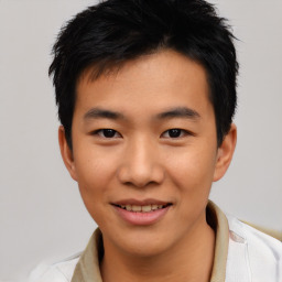 Joyful asian young-adult male with short  black hair and brown eyes