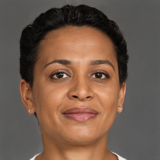 Joyful latino adult female with short  brown hair and brown eyes