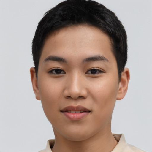 Joyful asian young-adult male with short  black hair and brown eyes