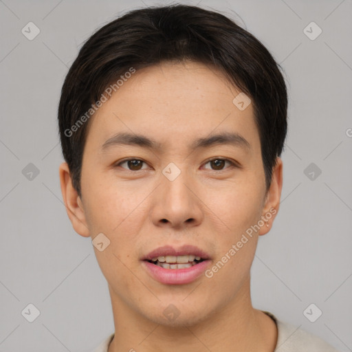 Joyful asian young-adult male with short  brown hair and brown eyes