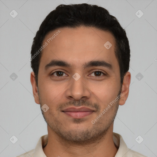 Joyful latino young-adult male with short  black hair and brown eyes