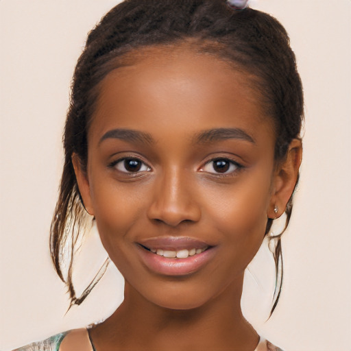 Joyful latino child female with long  brown hair and brown eyes