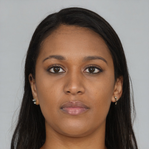 Neutral black young-adult female with long  brown hair and brown eyes